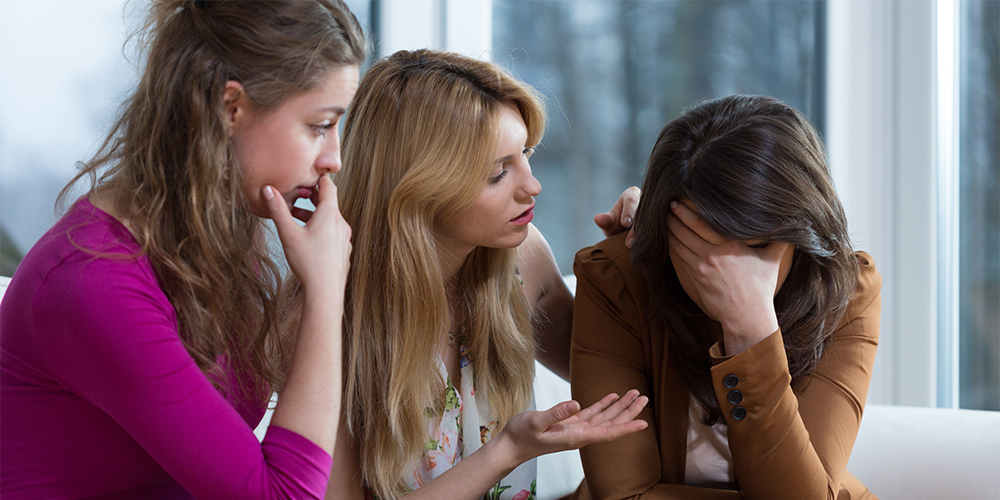 Three girl friends overcoming a difficult problem